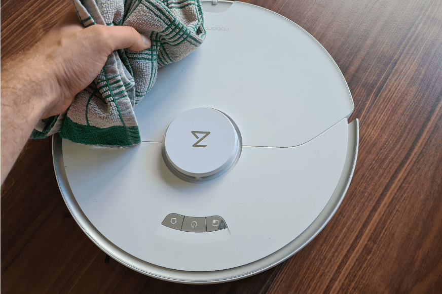 Wiping the Roborock S7 Pro with a towel.